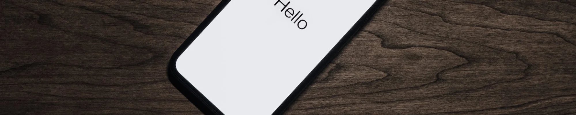 Mobile phone on a hardwood floor surface